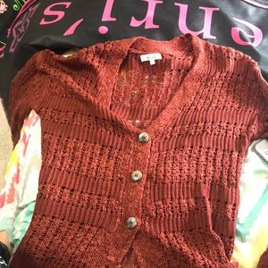 A maroon sweater